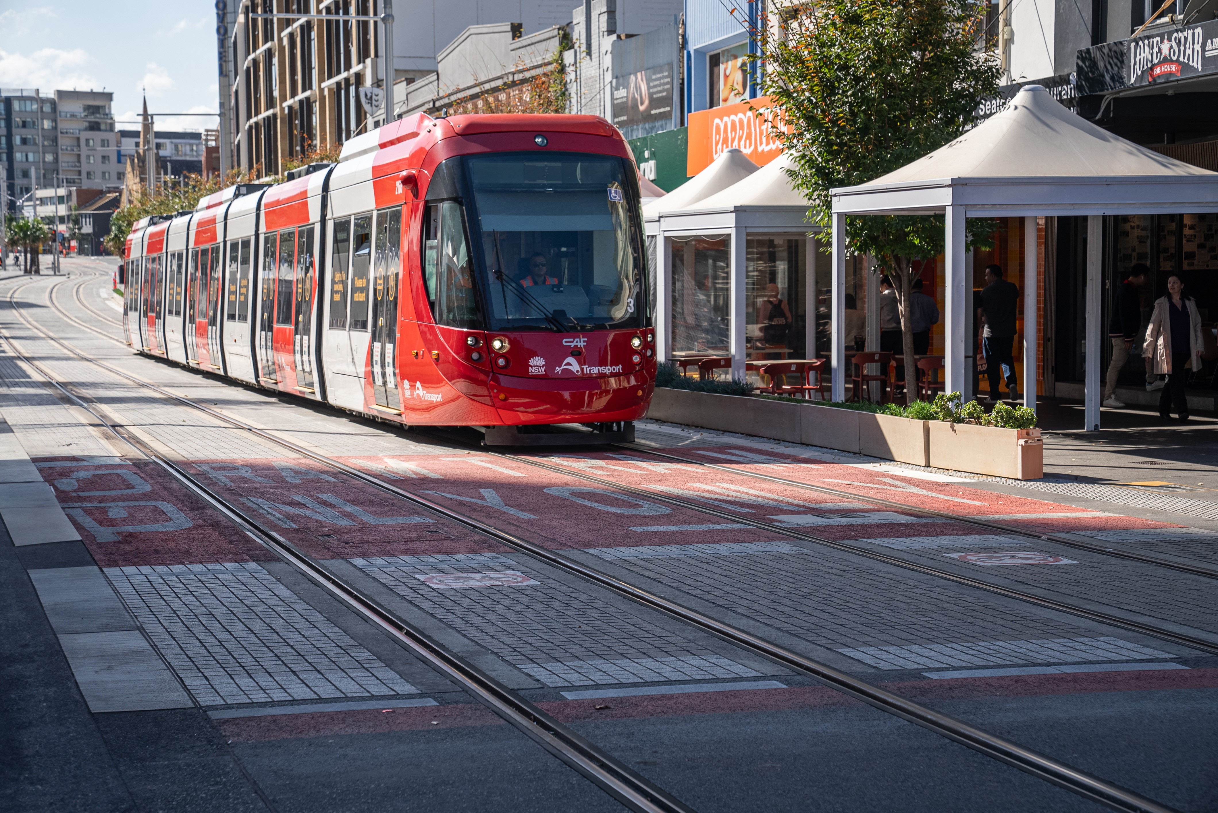 Parramatta Light Rail passing along Church Streen